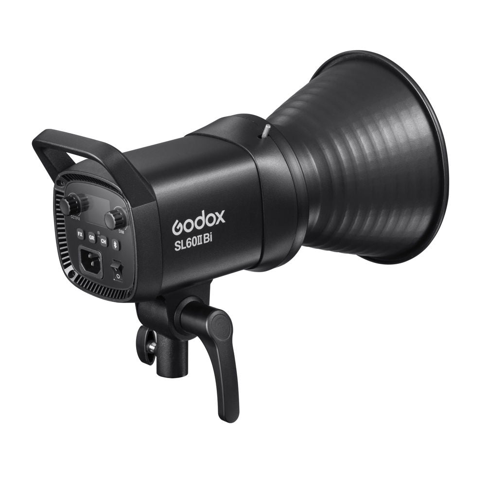 Angled LED studio light with back controls, black body, and vented grip
