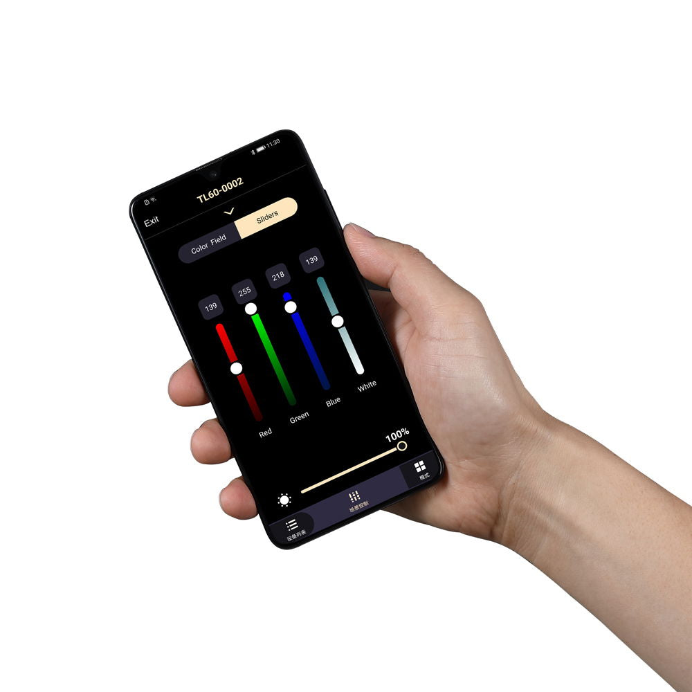Hand holding black smartphone remote with RGB color slider app screen
