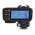 TTL wireless flash trigger with LCD display and hot-shoe mount, dark body