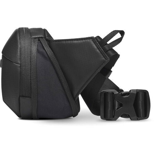 Black sling bag side view with adjustable strap and front zipper