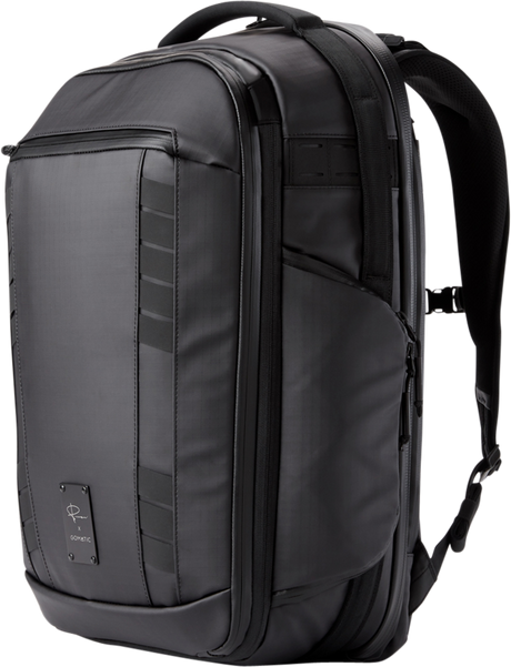 Black camera backpack side view with vertical padded panels and carry handle
