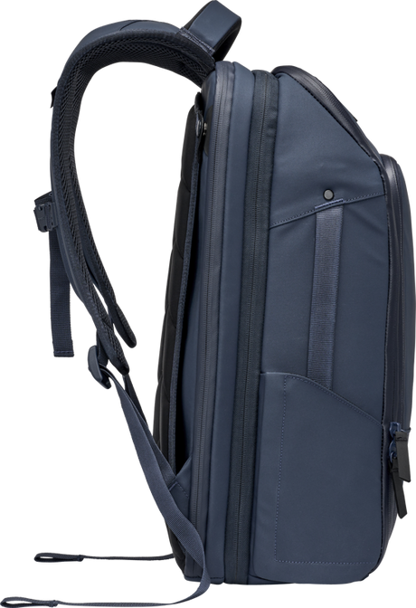 Navy travel backpack side profile with top handle, front strap, and zip pocket
