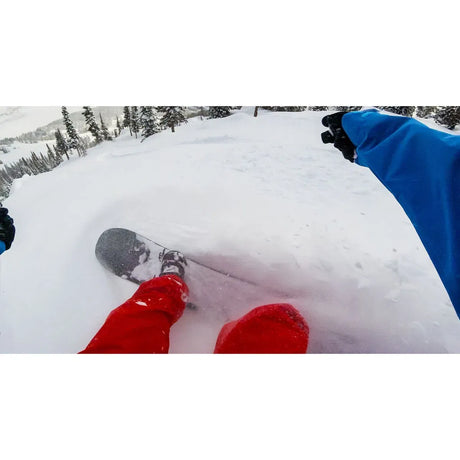 Head-mounted action camera POV over snowy slope