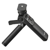 Black wireless shooting grip with compact tripod legs extended