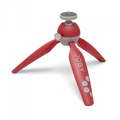 Red Joby mini tripod with three folding legs and ball head, close-up view