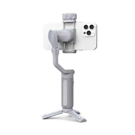 White smartphone gimbal stabilizer with fold-out tripod base and phone holder