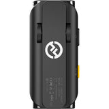 Back of black wireless microphone transmitter with label and charging contacts