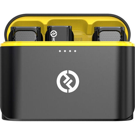 Charging case lid open, holding two black wireless USB‑C microphone transmitters