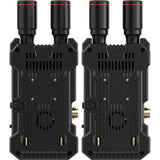 Underside of two wireless video units with vents and power/connector openings