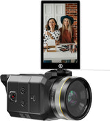 Black camera with LCD screen showing two people at a desk