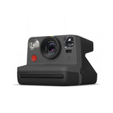 Black instant film camera angled view showing flash, lens, and front controls