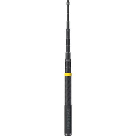 Extended selfie stick with segmented sections, dark finish and yellow connector band