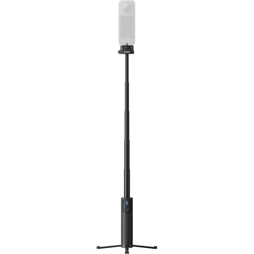 Black selfie stick with phone mount above and remote control on handle