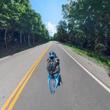 Rider wearing backpack with third-person camera mount pole over the back