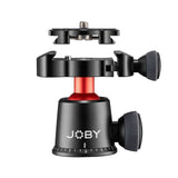 Camera tripod head with red center column, black housing and right textured control knob