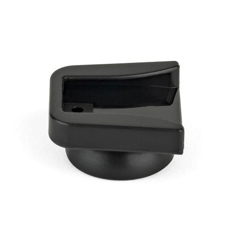 Black cold shoe mount end view with release slot and mounting cavity