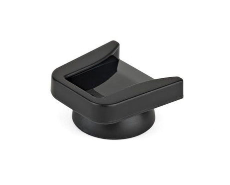 Black cold shoe mount with raised bracket and open slot for camera accessories