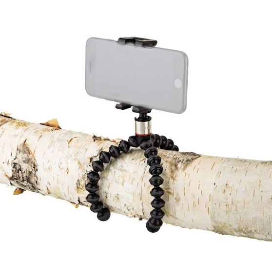Smartphone held on flexible tripod with black bendable legs