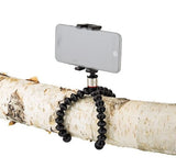 Smartphone held on flexible tripod with black bendable legs