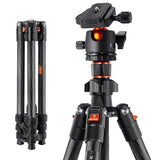 Carbon-fiber photo tripod with black head, orange accents, and adjustable knobs