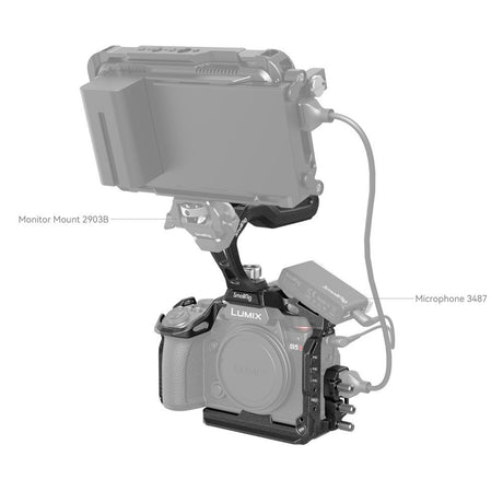 Black camera rig with monitor and microphone mounts for Lumix; cables attached