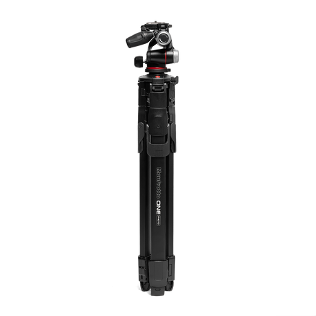 Black tripod with pan-tilt head mounted on tall center column and leg locks
