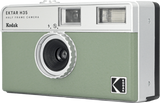 Front view of green half-frame camera with large circular lens and top windows