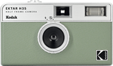 Green half-frame camera with black lens and top viewfinder and flash windows