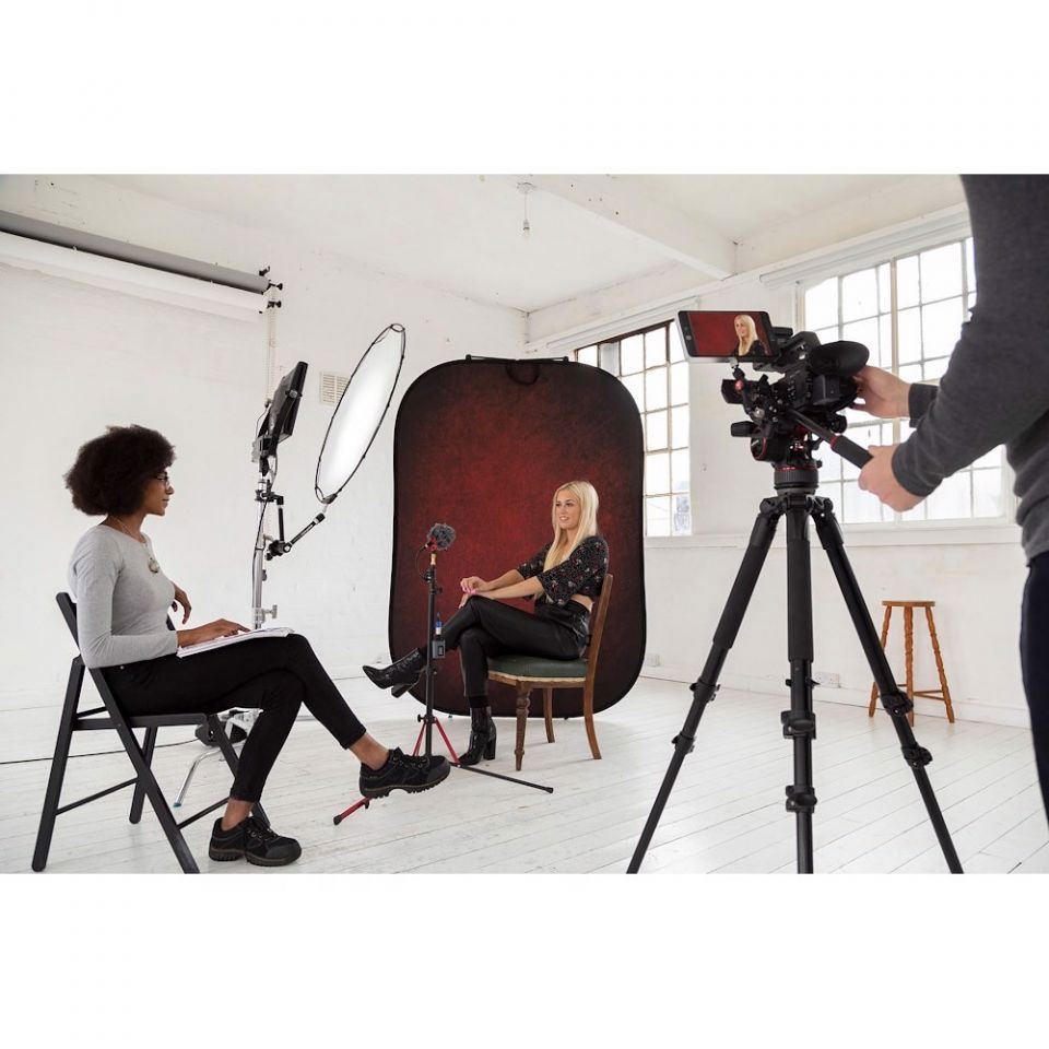Portable oval backdrop panel in studio setup, double-sided