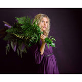 Portable oval backdrop panel behind subject, double-sided studio use