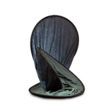 Folded portable backdrop with dark outer fabric and sage-green inner side