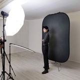 Pewter/charcoal portable photo backdrop panel on a stand in studio