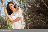Model portrait outdoors; reflector not visible in frame