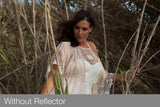 Model portrait outdoors; reflector not visible in frame