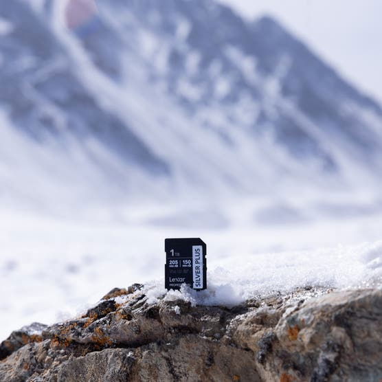 256GB SDXC UHS-I V30 SD card on snowy rocks