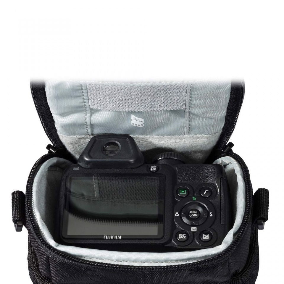 Open black camera bag showing a mounted digital camera with display and button controls