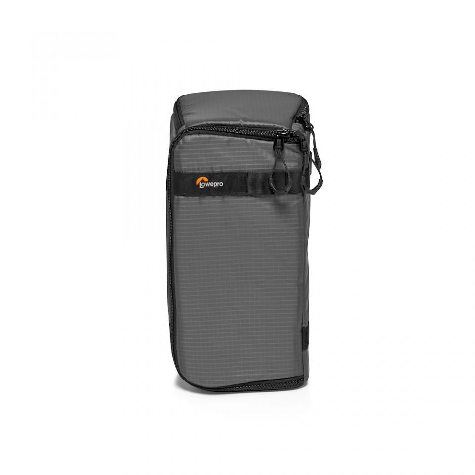Camera lens case in dark gray with top zipper, front logo patch, and carry strap