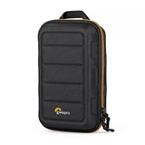 Black hard-shell camera case with padded grid front, orange zipper trim, top handle