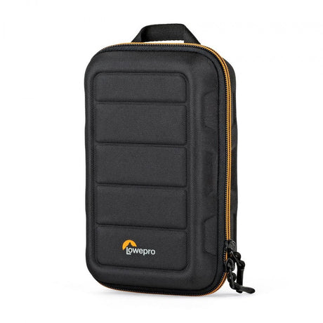 Black hard-shell camera case with padded grid front, orange zipper trim, top handle