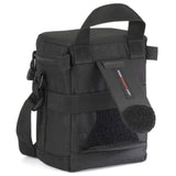 Black lens pouch with side carry strap, front webbing panels, and hook-and-loop pad