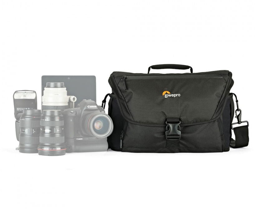 Black camera bag with top handle, front flap, and shoulder strap; front buckle pocket.