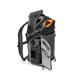 Black photo backpack open with camera and lens compartments visible at the front