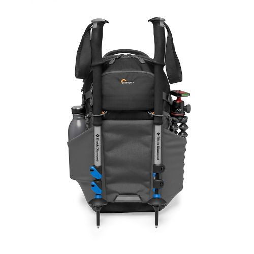 Black photo backpack back view with padded straps, top handle, and gear attachment points