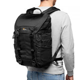 Black photo backpack back view with padded shoulder straps and grab handle
