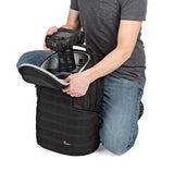 Photo backpack open with camera and lens mounts inside; hands adjusting contents