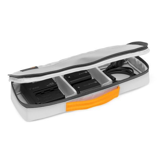 Open top compartment of camera backpack with organizer panels and orange storage strip
