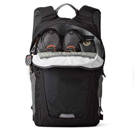 Black photo backpack open back showing camera compartments with lens covers