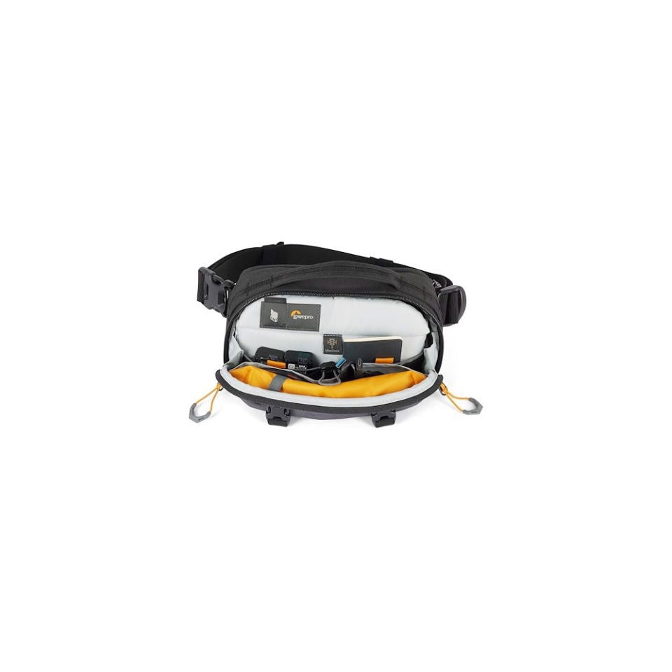 Open gray camera bag with padded dividers and yellow accessories at center