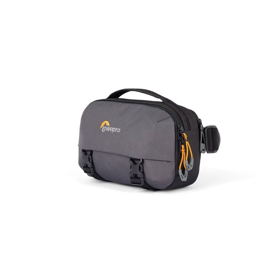 Gray camera bag with yellow zipper pulls and side strap hardware