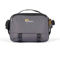 Gray camera sling bag with front buckles and top zipper handle, compact organizer